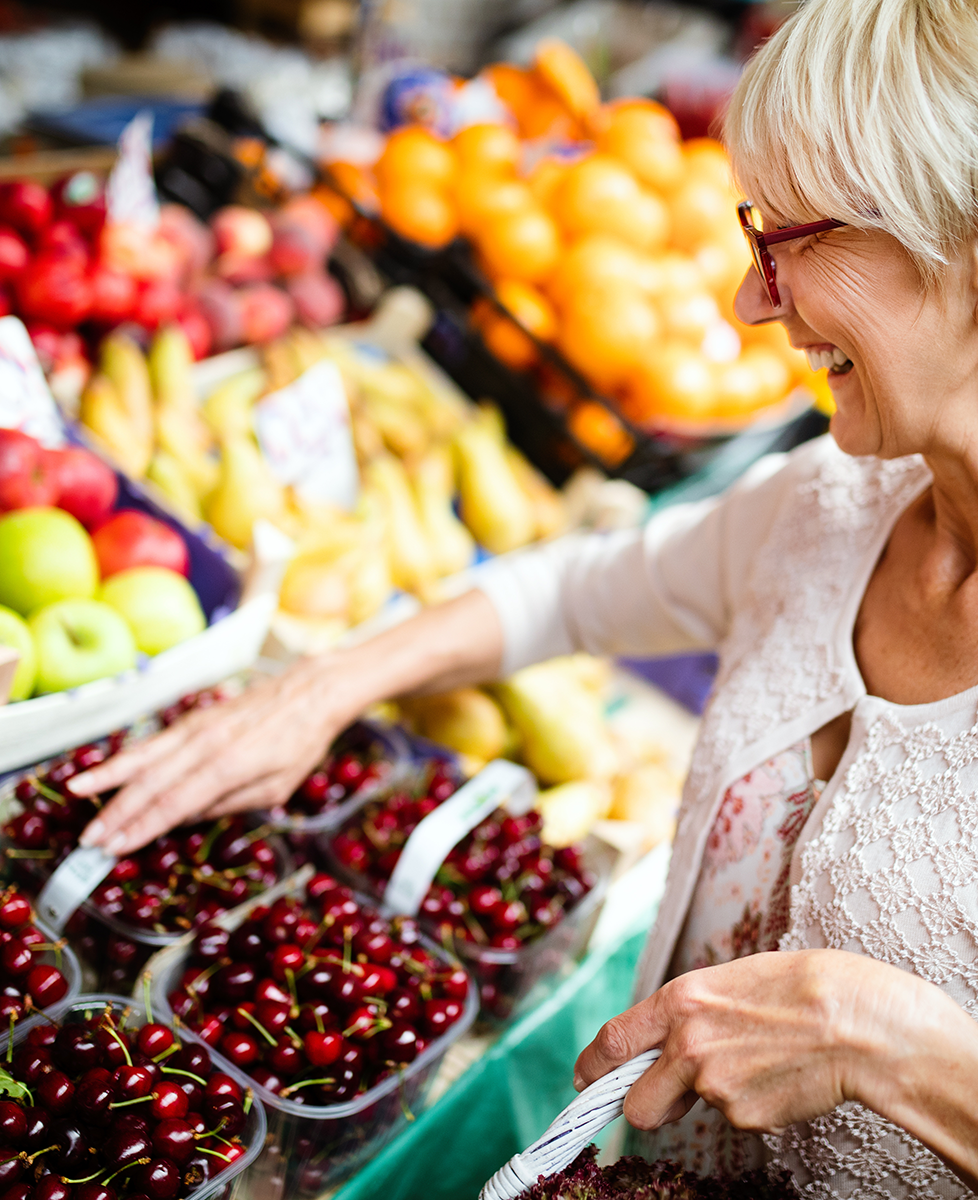 Adult shopping for healthy food at the farmers market.