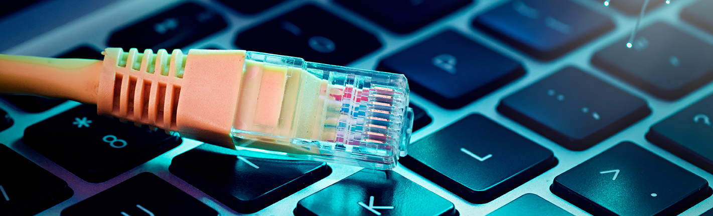 broadband-image Image of high speed cable on a computer keyboard.